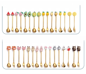 Golden stainless steel spoons and forks set with colorful resin fruit and animal handles