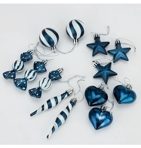 Close-up of 13pc blue and silver Christmas tree ornaments with glitter stripes and patterns