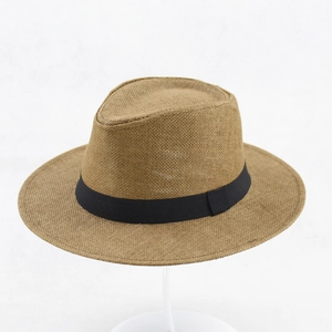 Close-up of the woven straw texture and black grosgrain ribbon on this summer sun hat