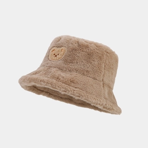 Plush brown faux lamb wool bucket hat with a cute bear patch for winter warmth