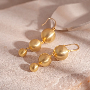 Minimalist gold-plated three-bead drop earrings with premium brushed metal texture finish
