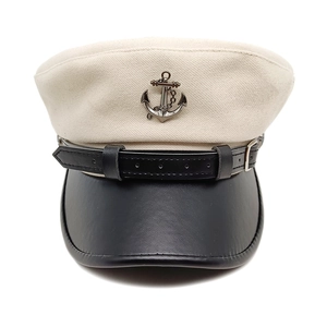 Classic newsboy sailor hat with beige twill crown, black leather brim and anchor detail