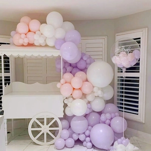White decorative cart with macaron balloons for party and celebration decor