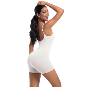 Close-up of white high-elastic yoga jumpsuit with slim straps and seamless athletic fit