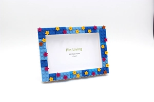 Close-up of DIY starry blue building block photo frame with stars for 4x6 inch photos