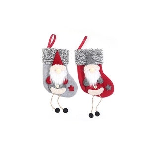 Christmas gnome stocking candy bags in red and grey felt with hanging ropes on white background