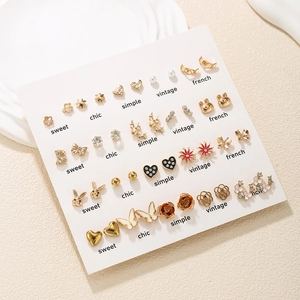 Detailed set of 20 pairs of cute gold stud earrings with animal and floral motifs
