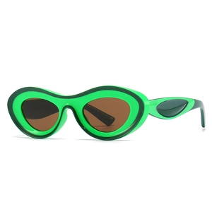 Modern oval green sunglasses with brown lenses and sleek teardrop frame for women