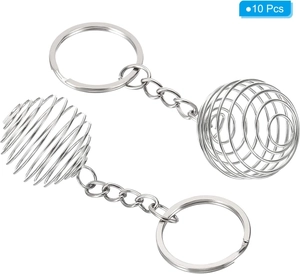 Close-up of 10-piece set silver spiral lantern cage pendant charms for DIY jewelry making