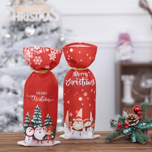 Festive set of 2 red fabric Christmas wine bottle covers with Santa and snowman patterns