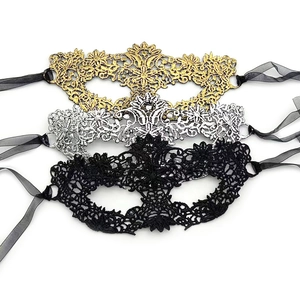 Lace masquerade eye masks in gold silver and black with silk ribbons on white background