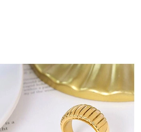 Macro detail of 18k gold plated ring featuring a unique vertical 3D pleated texture
