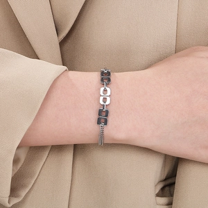 Close-up of a silver stainless steel interlocking square link bracelet with OT clasp