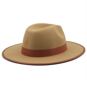 Detail of camel wool fedora hat with brown fabric ribbon and genuine leather binding edge