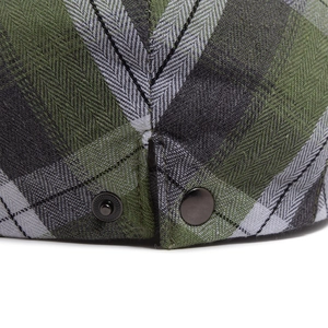 Classic plaid flat cap in green and black check with premium metal buckle detail