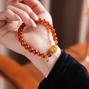 Orange garnet jasper gourd bracelet with gold heart-shaped diamond pendant in retro style