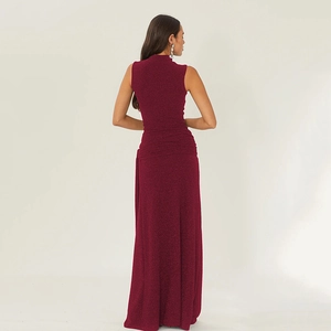 Detail of burgundy sleeveless maxi dress back view featuring shiny metallic fabric texture