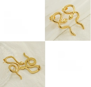 Detailed macro view of 18K gold plated snake stud earrings with polished finish and curves