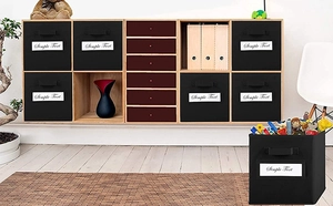 Detail of black fabric storage box with handle and label slot in wooden cabinet
