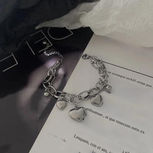 Double-layered silver titanium steel heart bracelet featuring a chunky link and bead chain