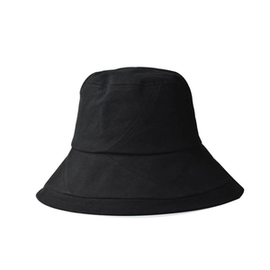 Classic black cotton bucket hat with geometric diagonal stitching on white background