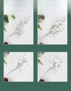 Detailed view of four types of artificial white berries for Christmas floral arrangements