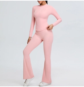Close-up of pink flared yoga pants with V-shaped waistband and high-elastic athletic fabric