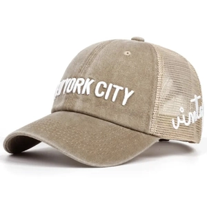 Macro detail of the vintage New York City embroidery and mesh fabric on the trucker hat