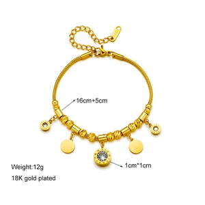 Gold plated stainless steel bracelet with blue turquoise and Roman numeral pendants