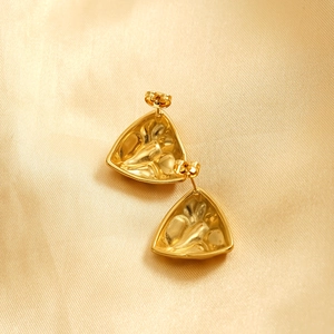 Irregular 18k gold plated stainless steel stud earrings with textured liquid metal surface