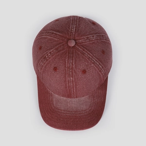 Top view of washed burgundy cotton baseball cap with ventilation eyelets and stitching details
