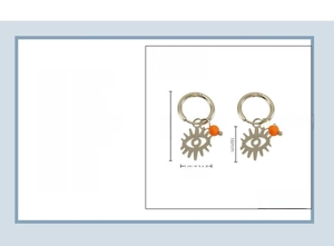 Detail view of 18K gold plated stainless steel evil eye earrings with orange stone