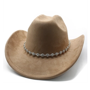 Detail of camel suede western cowboy hat featuring sparkling silver rhinestone band