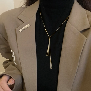 Minimalist Y-shaped titanium steel necklace with two geometric gold triangle pendants