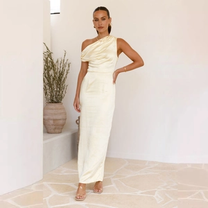 Elegant cream satin one-shoulder maxi dress with ruched detail and silky finish