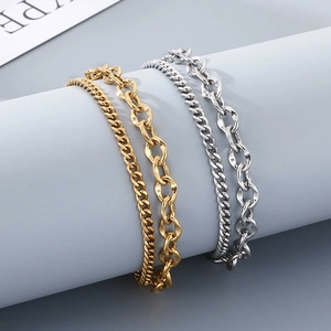 Minimalist gold and silver stainless steel Cuban and lip link bracelets on display