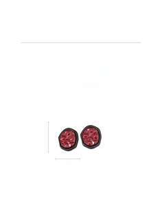 Detail view of burgundy resin earrings with black wave edges and silver needle posts