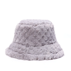 Close-up of gray plush bucket hat featuring soft faux fur with honeycomb textured pattern