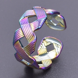 Detailed macro view of woven rainbow titanium steel ring with adjustable open band design