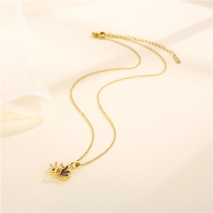 Gold peacock pendant necklace with colorful zircon stones on a soft beige background
