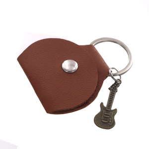 Brown leather guitar pick case keychain with silver snap button and vintage guitar charm