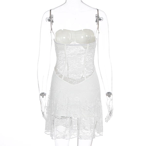 Detailed close-up of white lace mesh corset dress with floral texture and boning structure