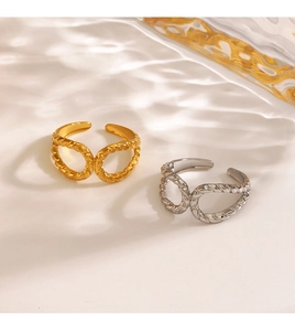 Detail of twisted rope dual-band adjustable rings in gold and silver stainless steel