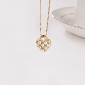 Elegant gold heart pendant necklace featuring inlaid pearls and diamonds on white background