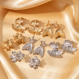 Ginkgo leaf and fishtail stainless steel earrings in gold and silver on silk