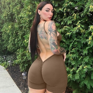 Rear view of brown backless jumpsuit featuring scrunch butt detail and ruched design