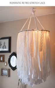 Detail of hanging romantic retro stretch lace lampshade with vintage wall decor