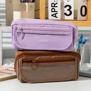 Dual-layer canvas pencil cases in purple and brown with clear window and ring zippers