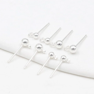 Macro detail of eight S925 sterling silver ball post earrings with jump rings for DIY