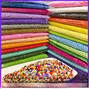 Macro shot of 2/3/4mm glass seed beads in multiple colors for DIY jewelry crafts